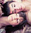 Foto: Young happy couple in bed Young happy couple in bed