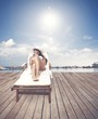 Photo: Girl relaxing on a beach Girl relaxing on a beach