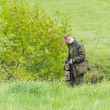 Wildlife photographer with long telephoto