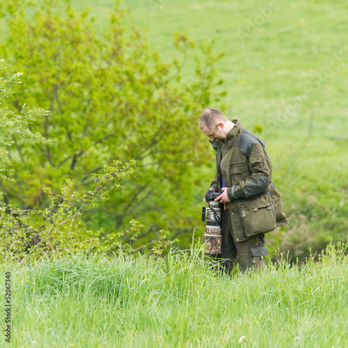 Photo: Wildlife photographer with long telephoto Wildlife photographer with long telephoto