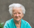 Smiling woman on a gray background