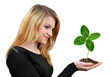 Photo: Girl holding in hand clover quarterfoil Girl holding in hand clover quarterfoil