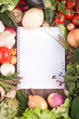 Photo: open notebook and fresh vegetables open notebook and fresh vegetables