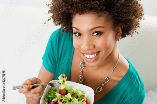 Photo: African American Woman Eating Salad African American Woman Eating Salad