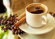 romantic background with coffee beans and a cup of coffee