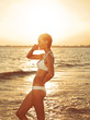 Girl standing in the sea side view