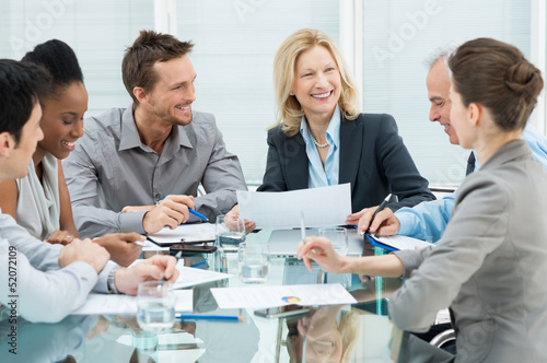 Photo: Happy Business People In Meeting Happy Business People In Meeting
