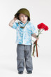 Boy with army helmet and carnations, isolated on white