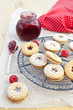 Jam-filled cookies and raspberries