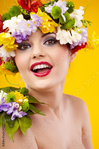Photo: The attractive girl, front portrait, on a head a flower wreath The attractive girl, front portrait, on a head a flower wreath