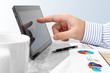 Foto: Male Hand Touching Tablet-PC Screen with Financial Chart Male Hand Touching Tablet-PC Screen with Financial Chart