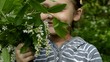 Video: girl smelling a bouquet of bird cherry girl smelling a bouquet of bird cherry