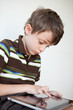 Photo: Child playing on a tablet PC Child playing on a tablet PC