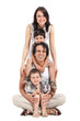 Photo: happy multiracial family of four studio portrait happy multiracial family of four studio portrait