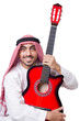 Arab man playing guitar isolated on white