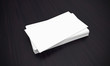 Business cards on dark background.