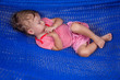 Photo: Little baby girl asleep outdoors on a hammock Little baby girl asleep outdoors on a hammock