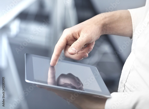 Photo: touching digital tablet touching digital tablet