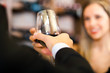 Couple toasting wine glasses