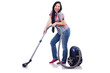 Young woman with vacuum cleaner on white