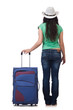Young woman with suitcase isolated on white