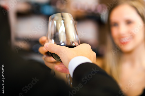 Photo: Couple toasting wine glasses Couple toasting wine glasses
