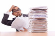 Busy businessman with lots of papers