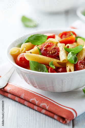 Photo: Penne with roasted cherry tomatoes and basil leaves Penne with roasted cherry tomatoes and basil leaves