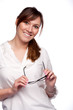 Portrait of smiling woman with glasses in her hands
