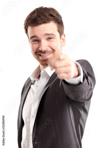 Photo: young business man pointing to the camera on white background young business man pointing to the camera on white background