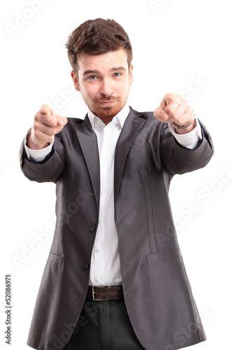Photo: young business man pointing to the camera on white background young business man pointing to the camera on white background