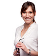 Portrait of smiling woman with glasses in her hands