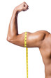 Muscular man measuring his muscles