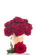 beautiful red roses in a wooden bucket