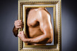 Muscular man with picture frame