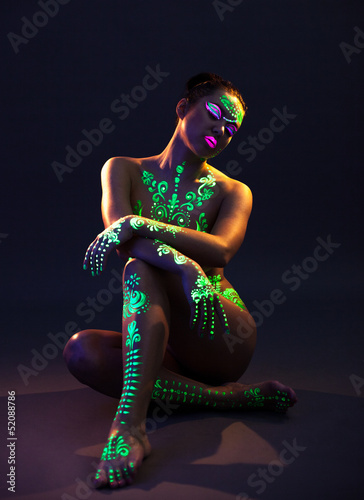 Photo: Graceful model posing with UV pattern on body Graceful model posing with UV pattern on body