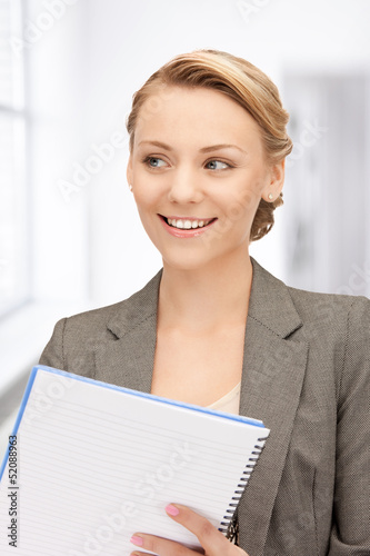 Photo: happy woman with big notepad happy woman with big notepad
