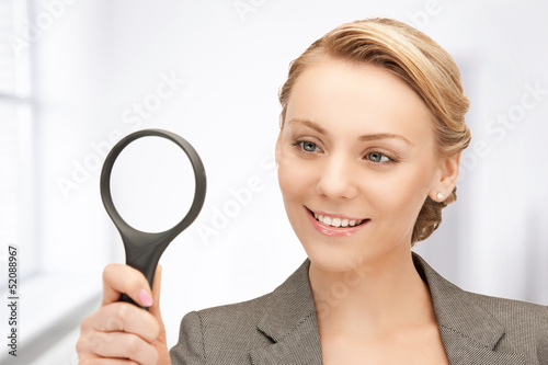 Photo: woman with magnifying glass woman with magnifying glass