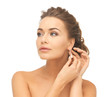 woman wearing shiny diamond earrings
