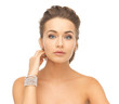 woman with pearl earrings and bracelet