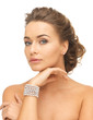 woman with pearl earrings and bracelet