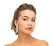 woman wearing shiny diamond earrings