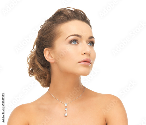 Photo: woman wearing shiny diamond necklace woman wearing shiny diamond necklace