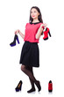 Young woman with choice of shoes on white