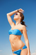 woman in bikini and sunglasses