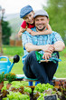 Photo: Gardening - father and daughter working in vegetable garden Gardening - father and daughter working in vegetable garden