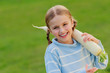 Photo: Vegetable - lovely girl with big radish in the garden Vegetable - lovely girl with big radish in the garden