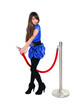 nice girl posing near red rope barrier