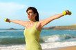 Fitness woman working out on beach