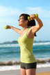 Photo: Fitness woman work out on beach Fitness woman work out on beach